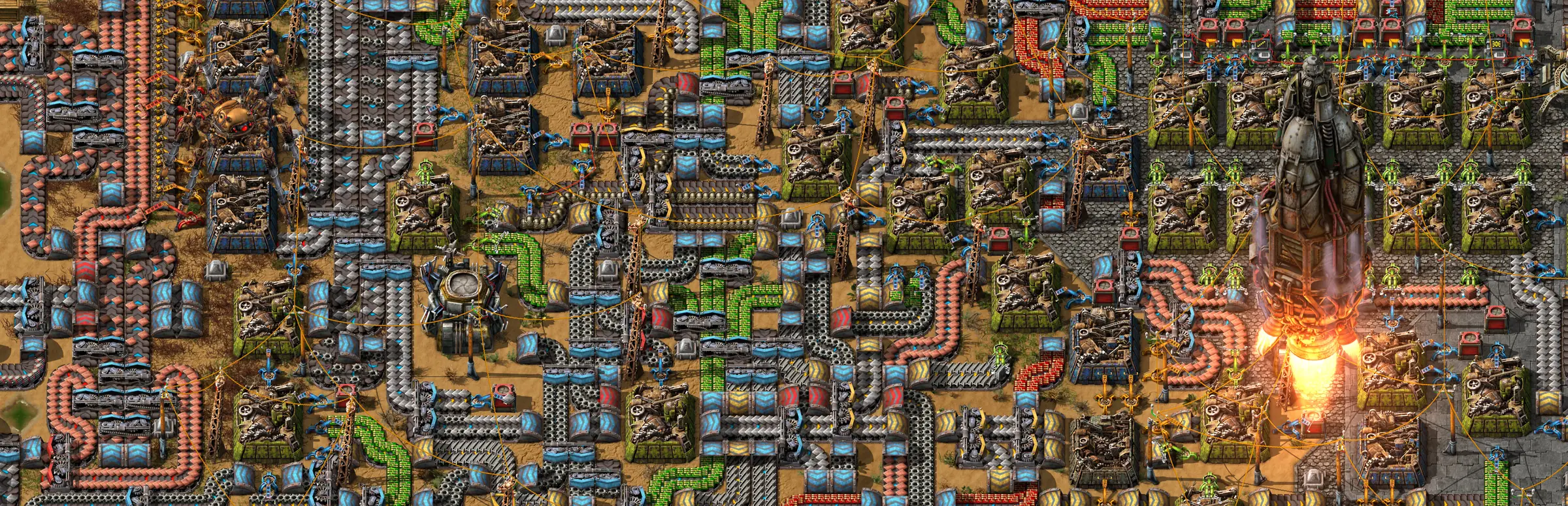 Factorio Server mieten: riesige Fabrik aus Förderbändern und Montagemaschinen von oben, während eine Rakete abhebt