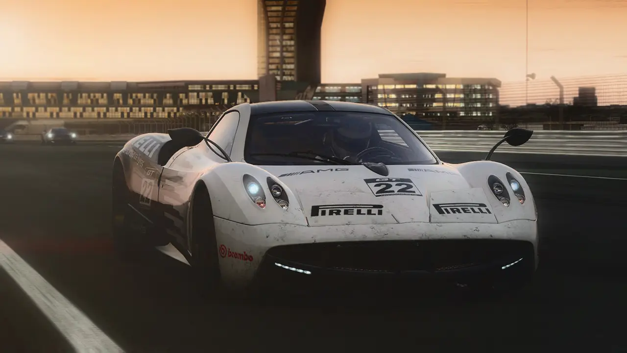 Project CARS server hosting: a white Pagani supercar races down a track at dusk past the pit buildings