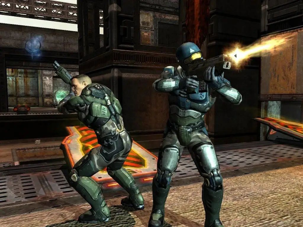 Quake 4 server hosting: two armoured marines open fire with their rifles in a rusty industrial hangar