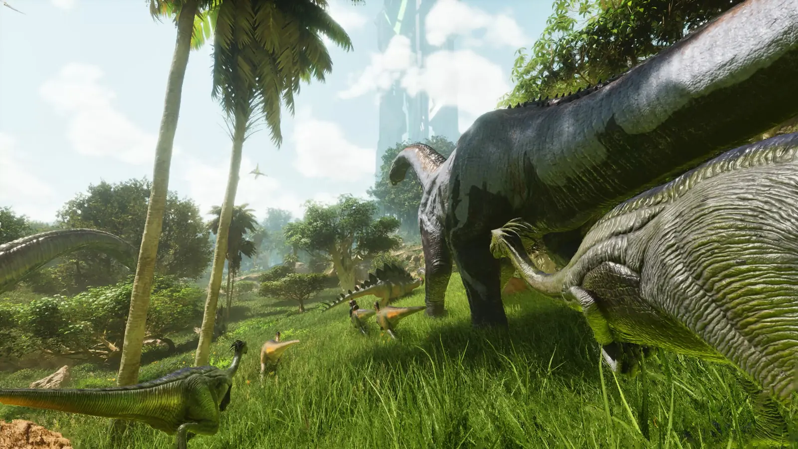 ARK server setup: long-necked Brontosaurus graze a sunlit jungle meadow beside a Stegosaurus and smaller dinosaurs, with a glowing obelisk behind the palms
