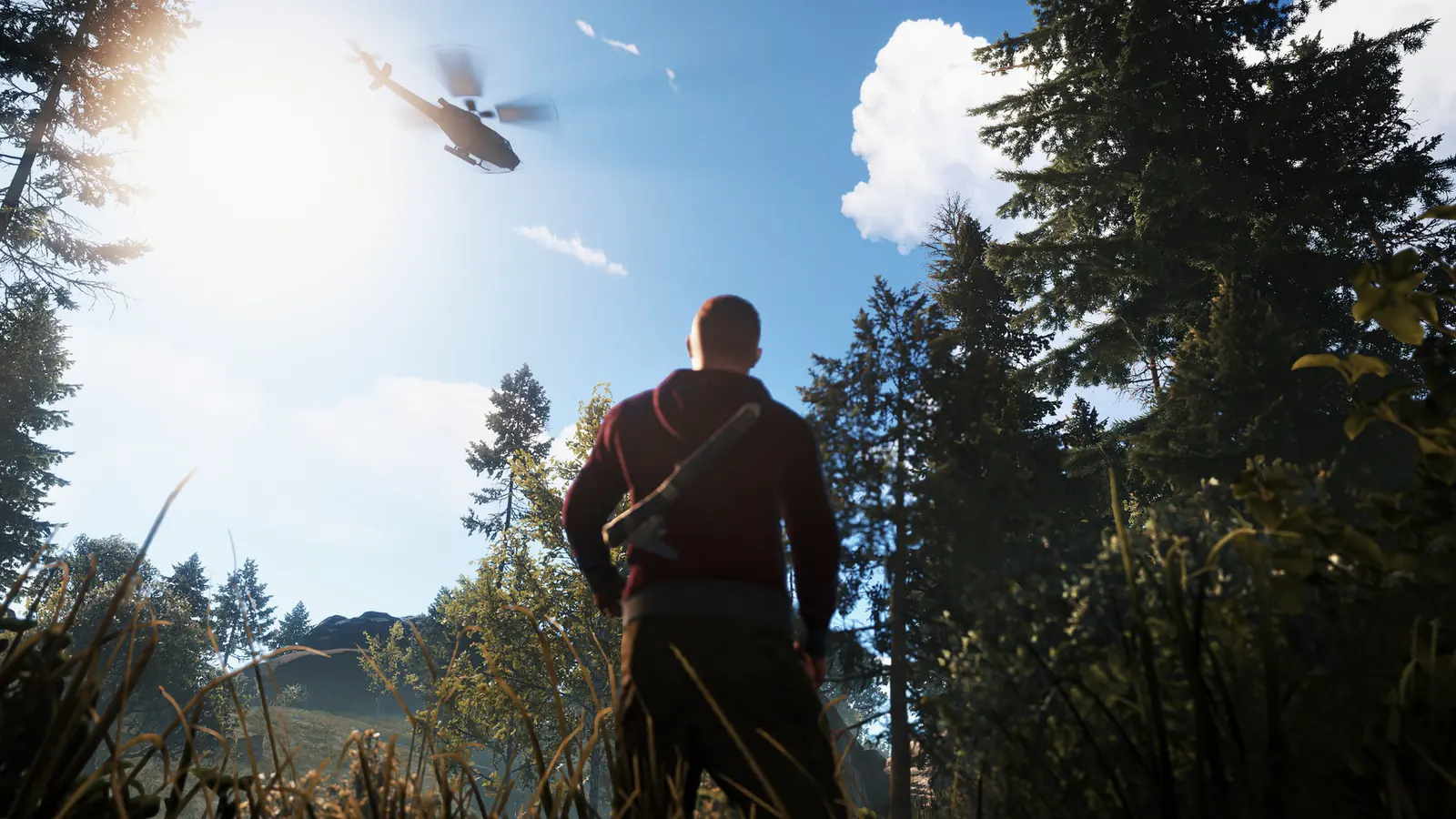 Rust server setup: a survivor with a salvaged axe on his back watches a helicopter sweep low over a sunlit pine forest